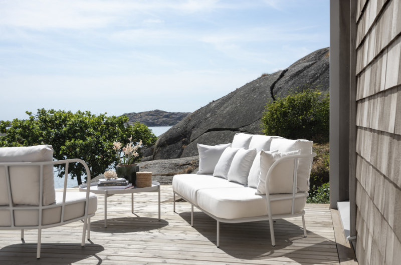 The sofas and accompanying side tables of the Saltö collection look equally good indoors and out.