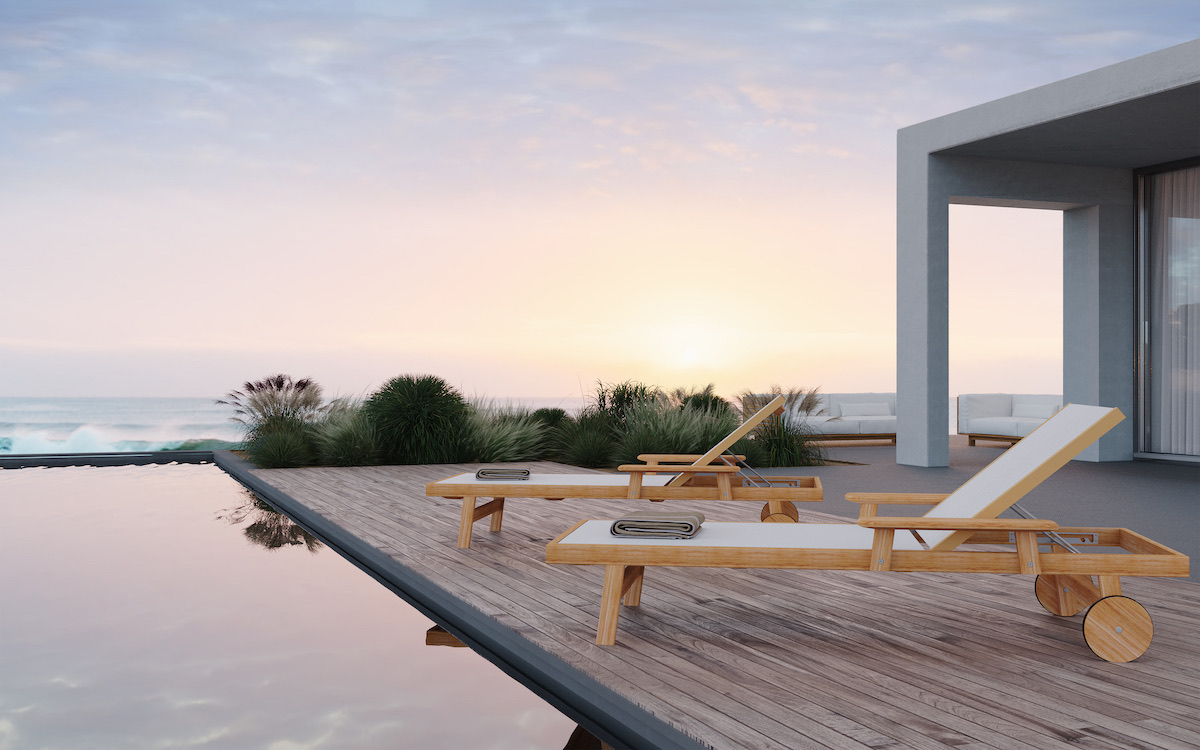 Djurö teak sun loungers by Skargaarden beside a modern outdoor pool