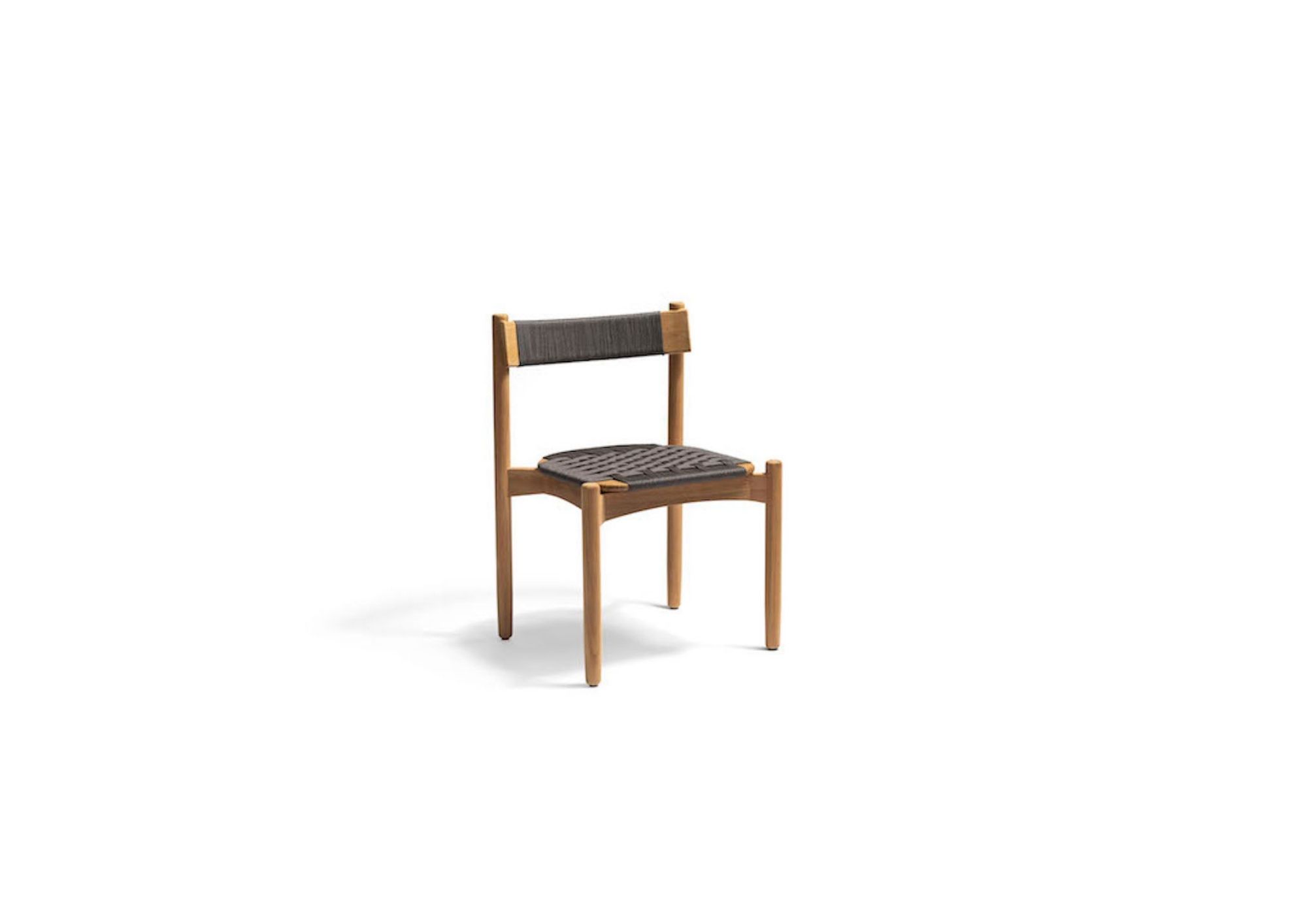 Koster outdoor dining furniture by Skargaarden on a modern terrace overlooking the sea.